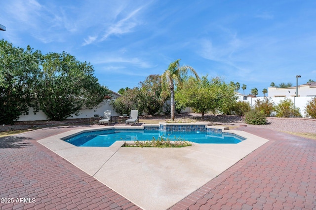 view of pool with a patio area, fence, and a fenced in pool