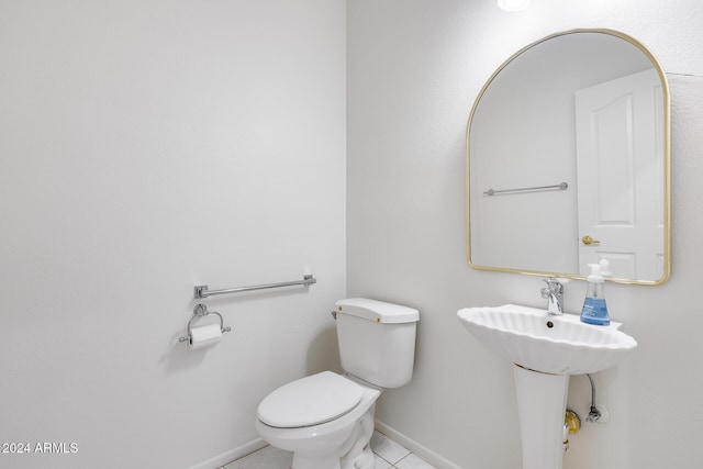 bathroom featuring tile patterned floors and toilet