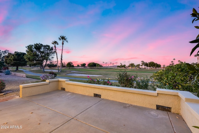 view of patio terrace at dusk