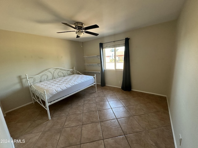 unfurnished bedroom featuring tile patterned floors and ceiling fan