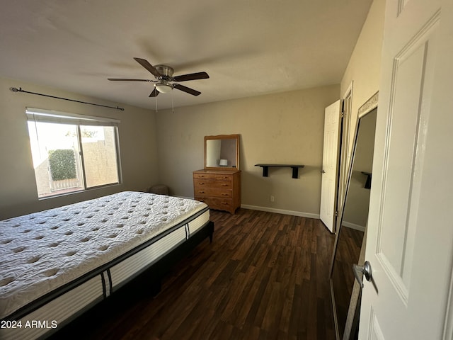 bedroom with ceiling fan and dark hardwood / wood-style flooring