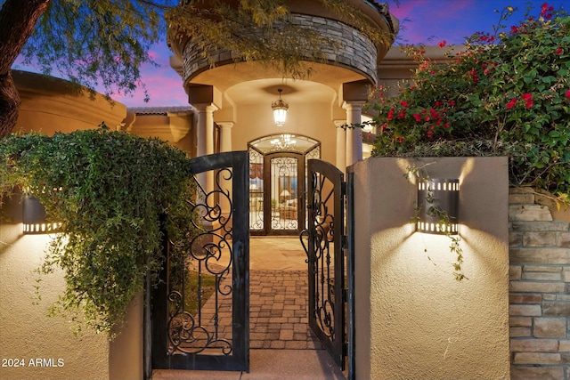 view of gate at dusk