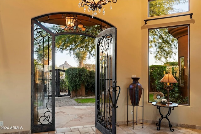 foyer featuring a chandelier