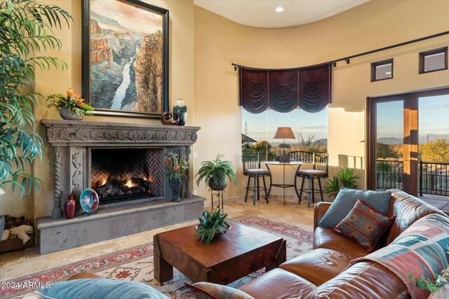 living room featuring a premium fireplace