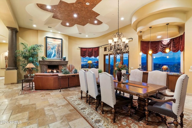 dining room featuring a notable chandelier and a towering ceiling