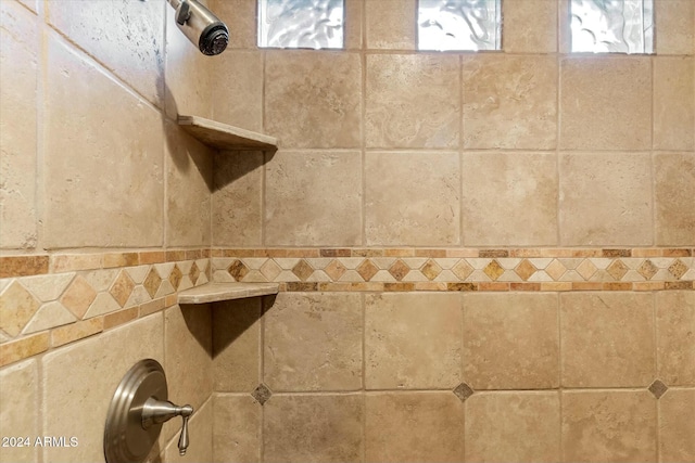 details with a tile shower