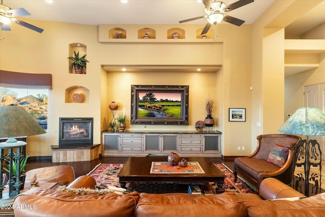 living room with hardwood / wood-style floors and ceiling fan