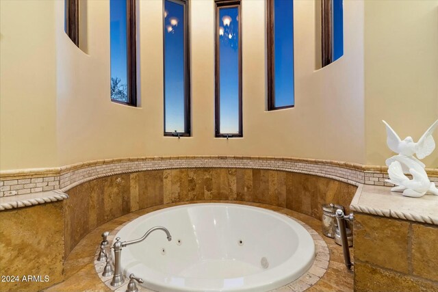 bathroom featuring tiled bath