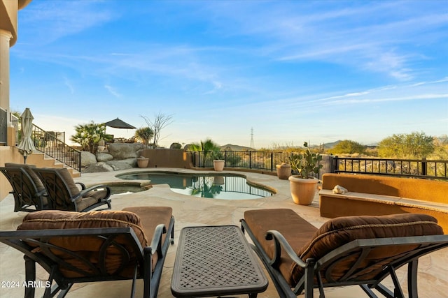 view of swimming pool with a patio area