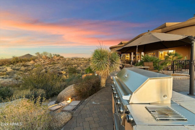 patio terrace at dusk with area for grilling