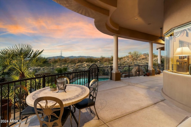 view of patio terrace at dusk