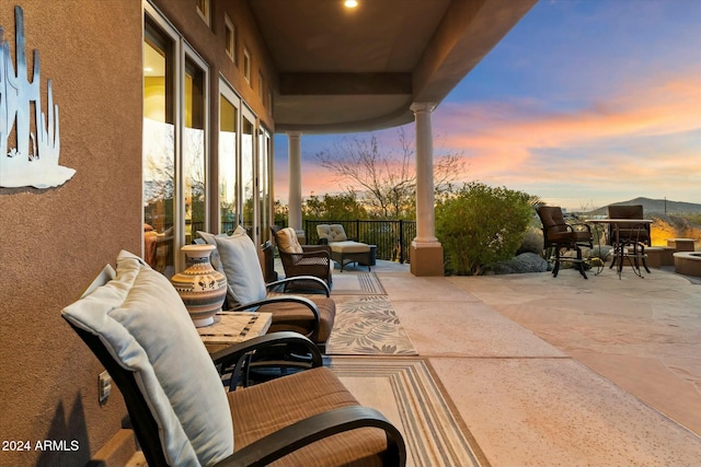 view of patio terrace at dusk