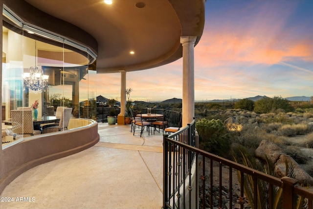 patio terrace at dusk with a mountain view