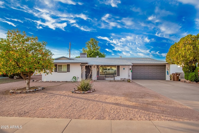 ranch-style home featuring a garage