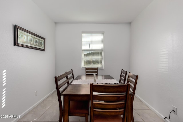 dining area featuring light tile patterned flooring