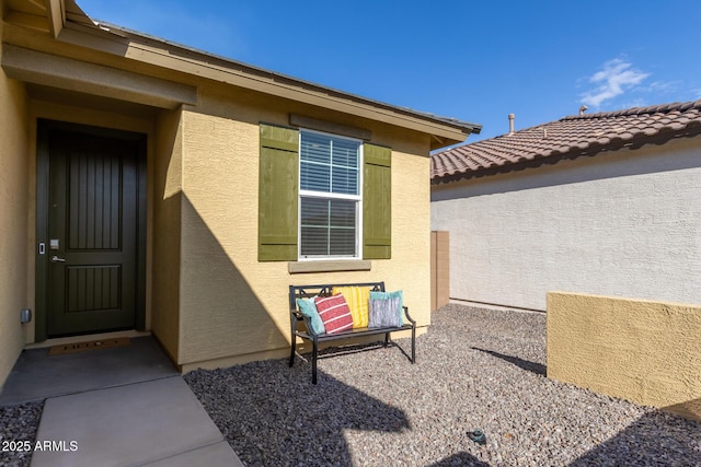 doorway to property with a patio