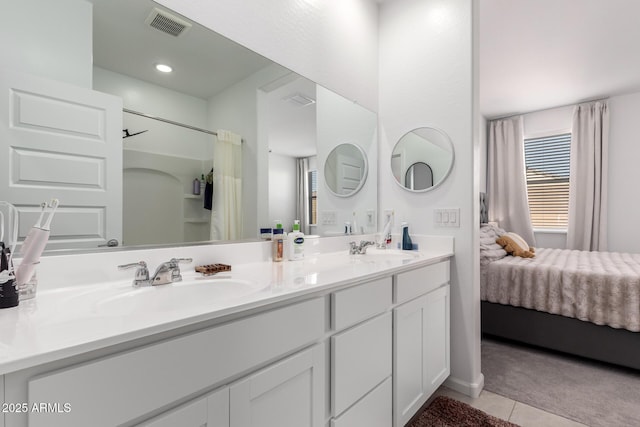 bathroom featuring tile patterned floors and vanity