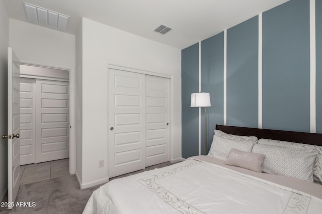 carpeted bedroom featuring a closet