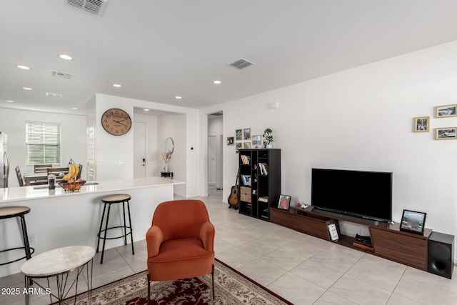 living room with light tile patterned floors