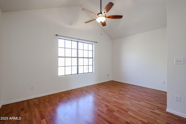 unfurnished room with hardwood / wood-style flooring, high vaulted ceiling, and ceiling fan