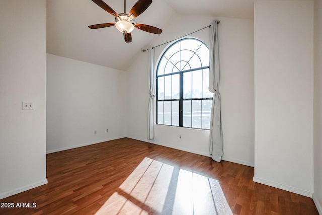 unfurnished room with hardwood / wood-style flooring, ceiling fan, and vaulted ceiling