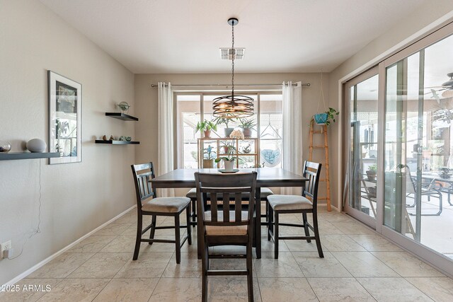 dining area featuring baseboards and visible vents