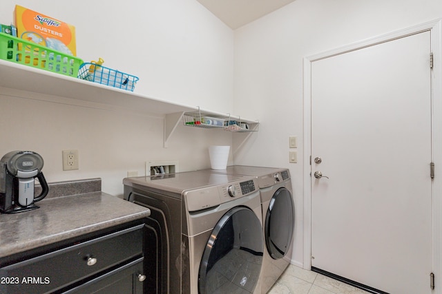 laundry room featuring washer and dryer, laundry area, and light tile patterned floors