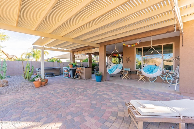 view of patio / terrace featuring a fenced backyard, a pergola, and a hot tub