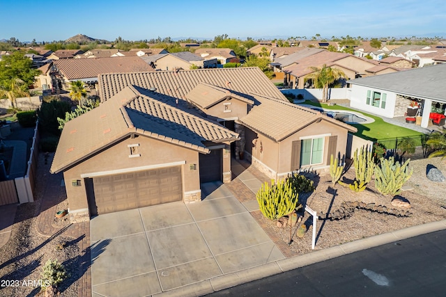 birds eye view of property with a residential view