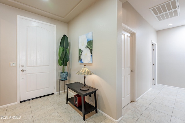 foyer entrance featuring recessed lighting, baseboards, and visible vents