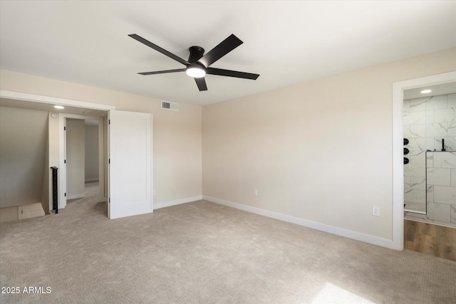 unfurnished bedroom with carpet flooring, baseboards, visible vents, and ceiling fan