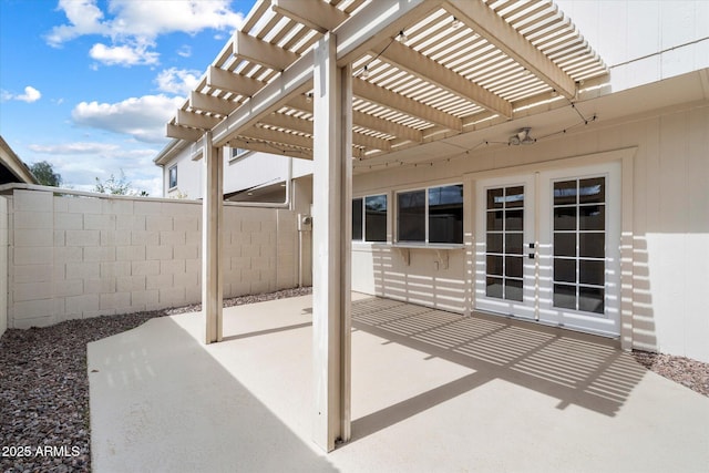 view of patio / terrace featuring fence and a pergola