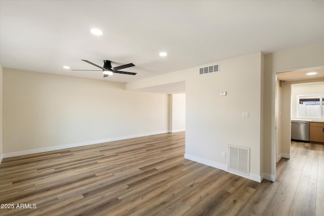 unfurnished room featuring recessed lighting, visible vents, baseboards, and light wood-style floors