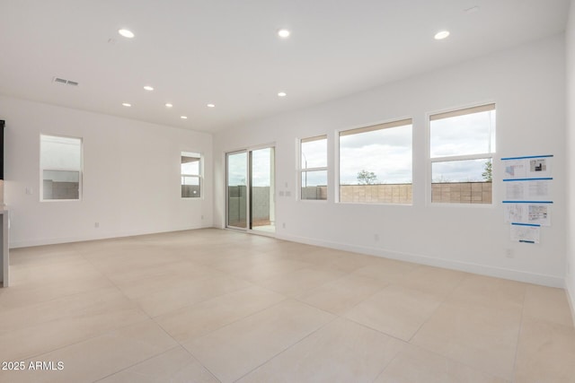 spare room with baseboards, light tile patterned floors, visible vents, and recessed lighting