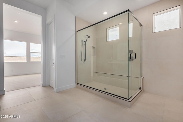 bathroom featuring tile patterned flooring, a shower stall, and recessed lighting