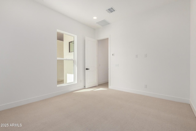 unfurnished room featuring light carpet, recessed lighting, visible vents, and baseboards