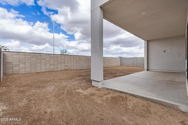 view of yard featuring a fenced backyard and a patio