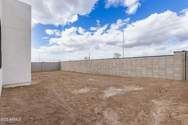 view of yard with a fenced backyard