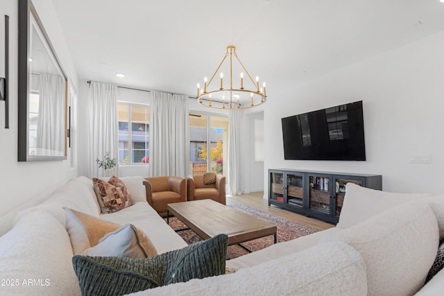 living room with a chandelier and wood-type flooring