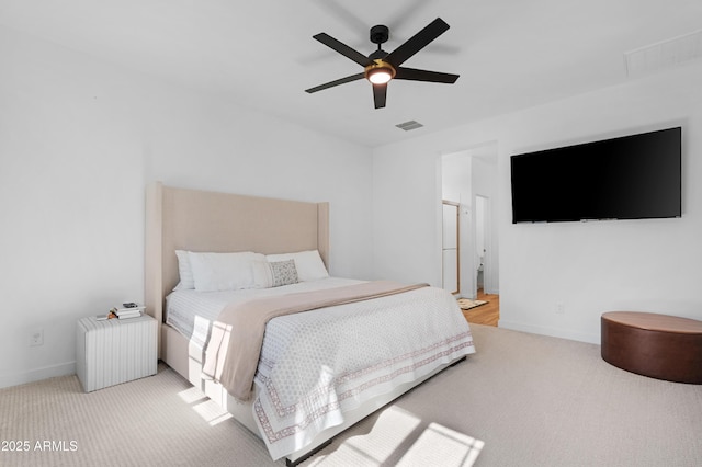 bedroom with light colored carpet and ceiling fan