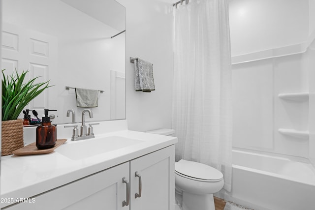 full bathroom featuring toilet, shower / tub combo, hardwood / wood-style floors, and vanity