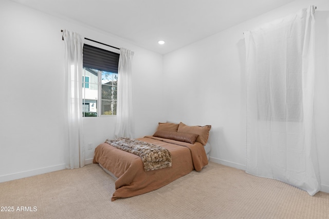 bedroom featuring light colored carpet