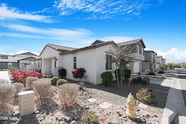 view of side of home with a garage