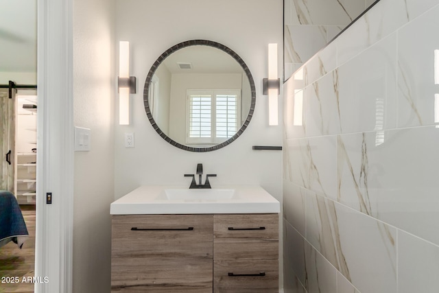 bathroom featuring visible vents and vanity