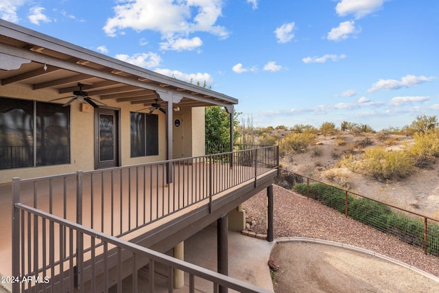 exterior space featuring ceiling fan