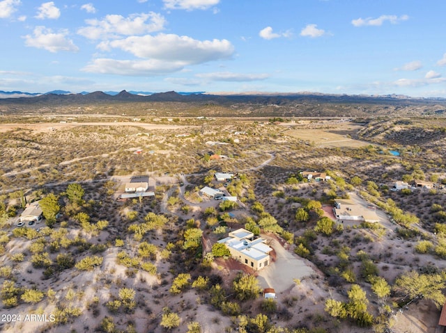 birds eye view of property with a mountain view