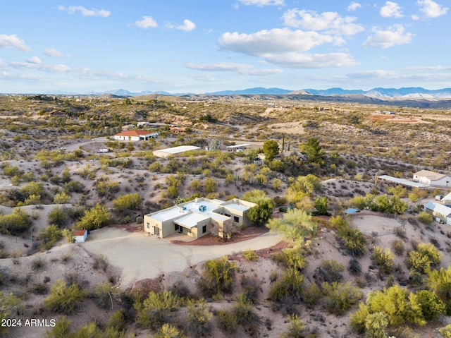 birds eye view of property featuring a mountain view