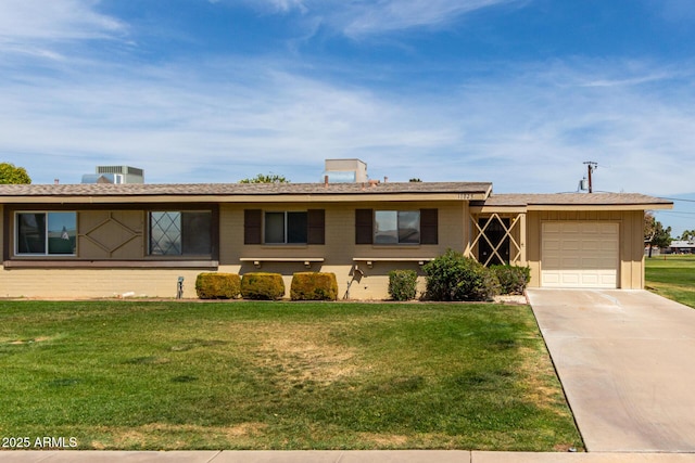 single story home with a front yard, driveway, and a garage