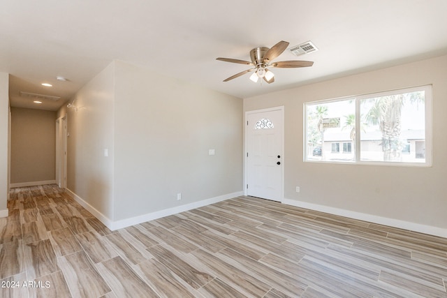 foyer with light wood-type flooring and ceiling fan