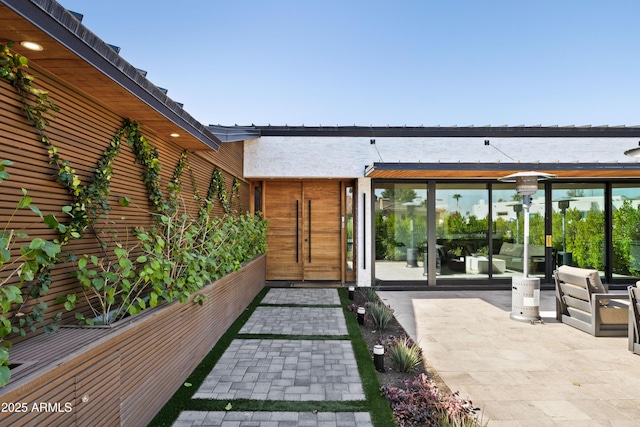 exterior space featuring a water view and a patio